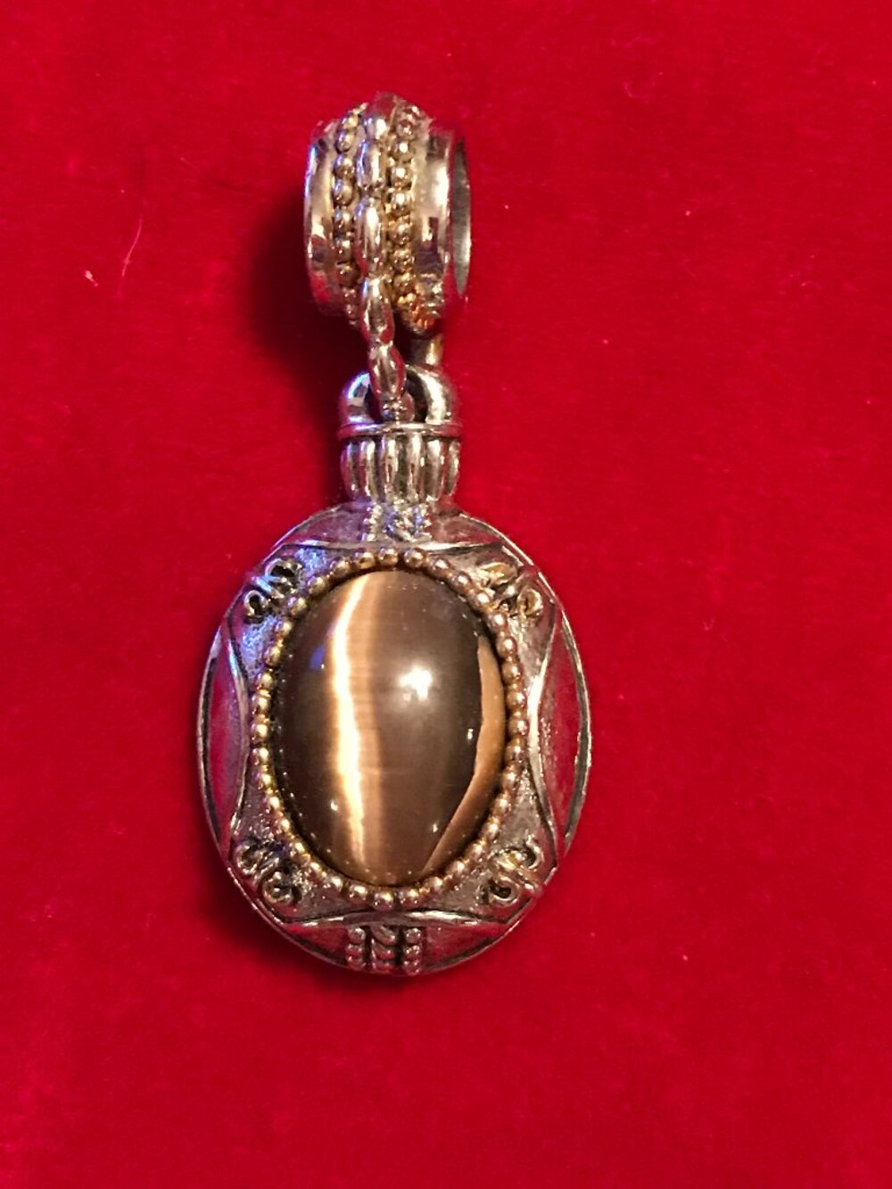 Ornate Silver Tone Oval Tiger's Eye Pendant